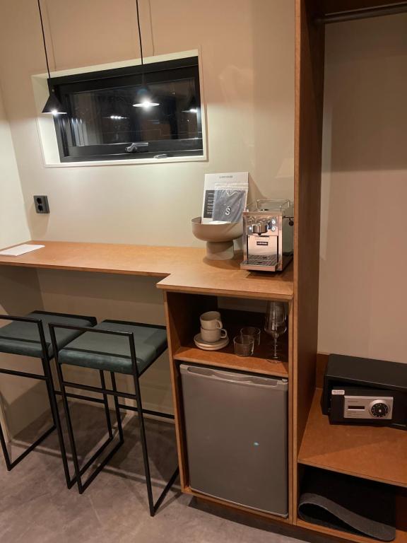 Kuchyň nebo kuchyňský kout v ubytování Chambre hotell