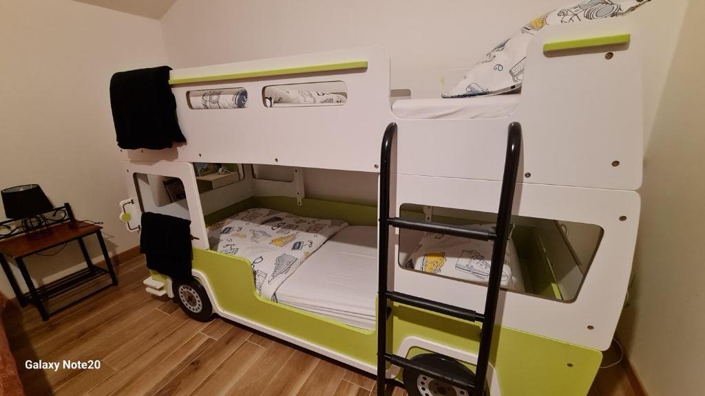 a small room with a bunk bed in it at La Thibaudière Gite 70m2 in Mirebeau