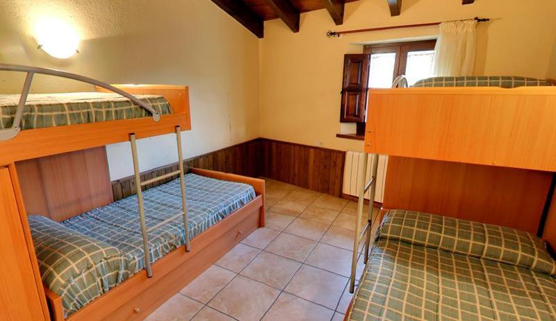 Postel nebo postele na pokoji v ubytování Can Grau Rupit