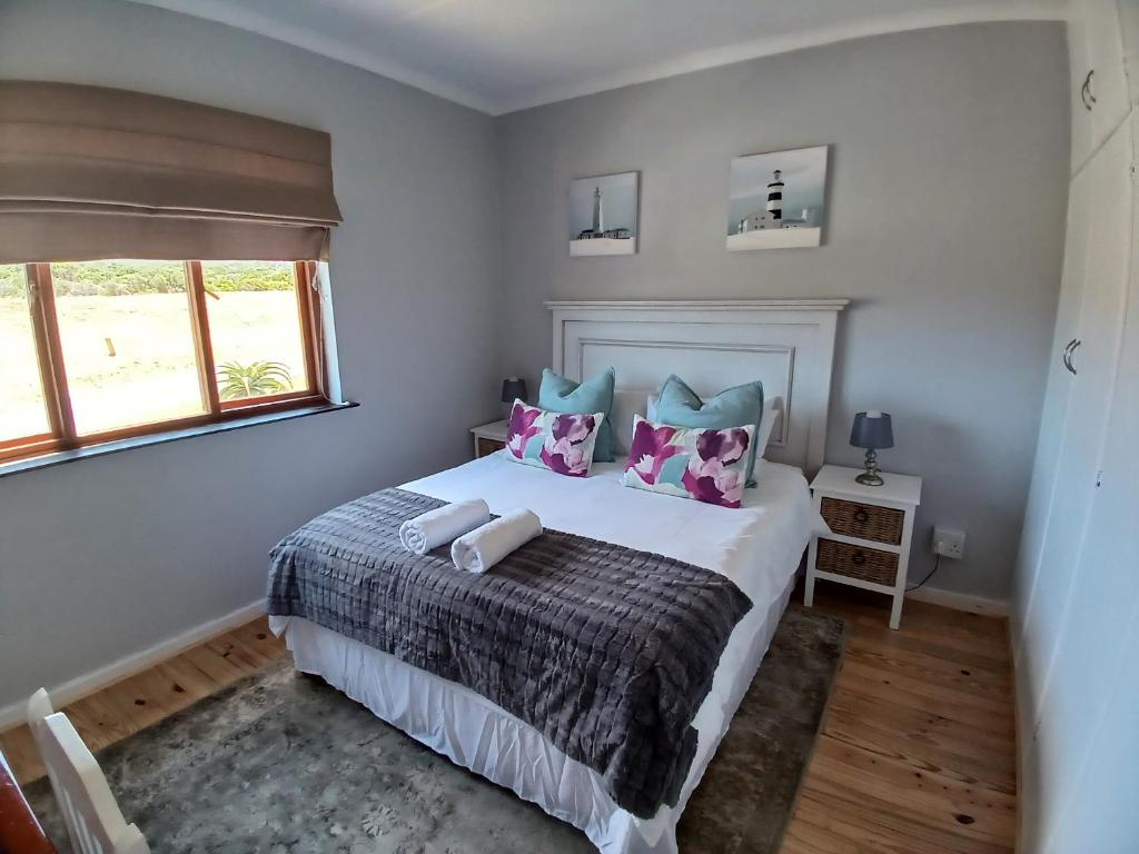 Katil atau katil-katil dalam bilik di Vergezicht Holiday Home