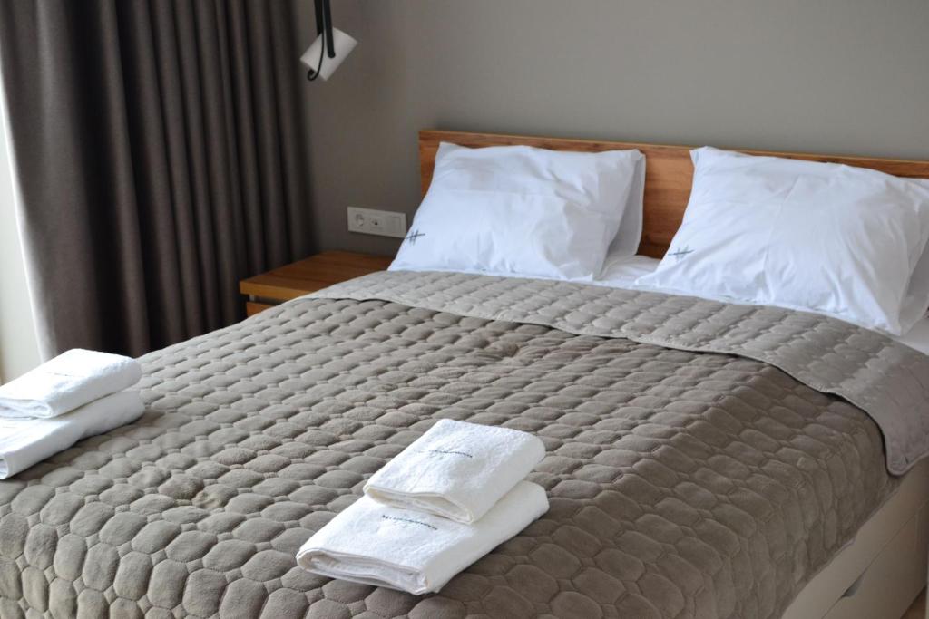 Postel nebo postele na pokoji v ubytování Village apartments Polyana