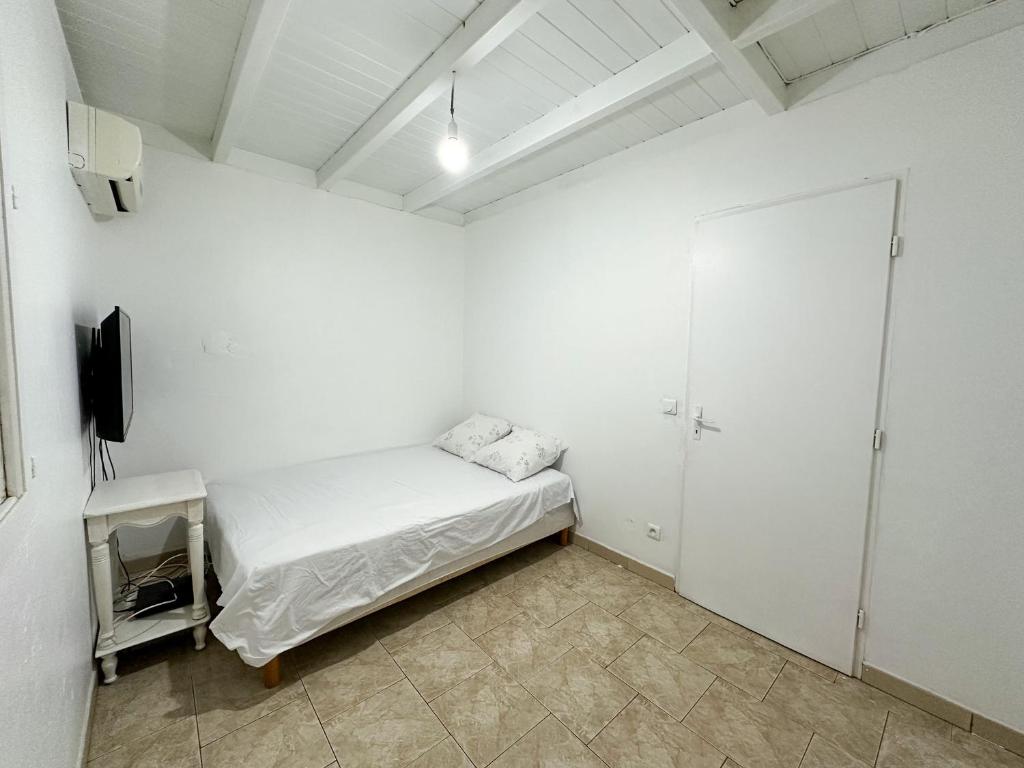 Postel nebo postele na pokoji v ubytování Maison à 3 min à pied de la plage