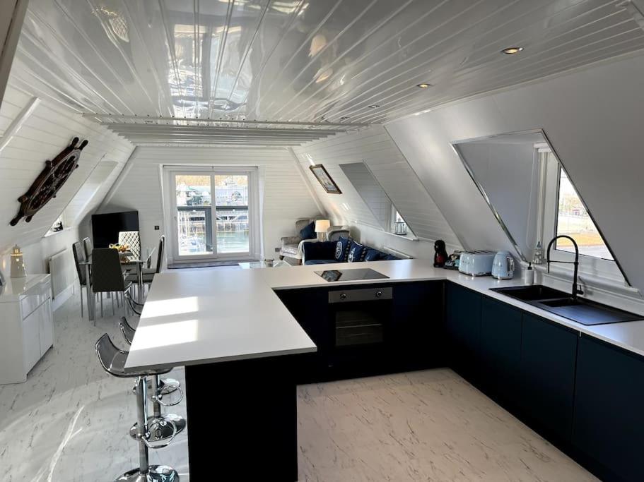 a kitchen with a sink and a counter top at Luxury Detached House in Torquay Marina in Torquay