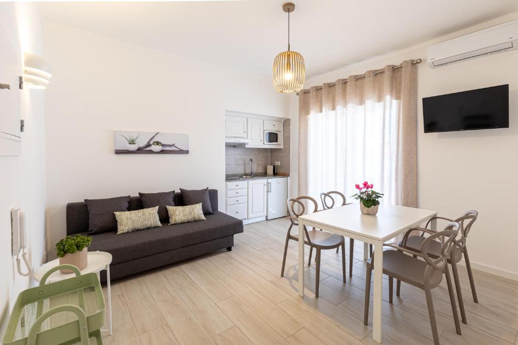 TV a/nebo společenská místnost v ubytování Faro Guest Apartments