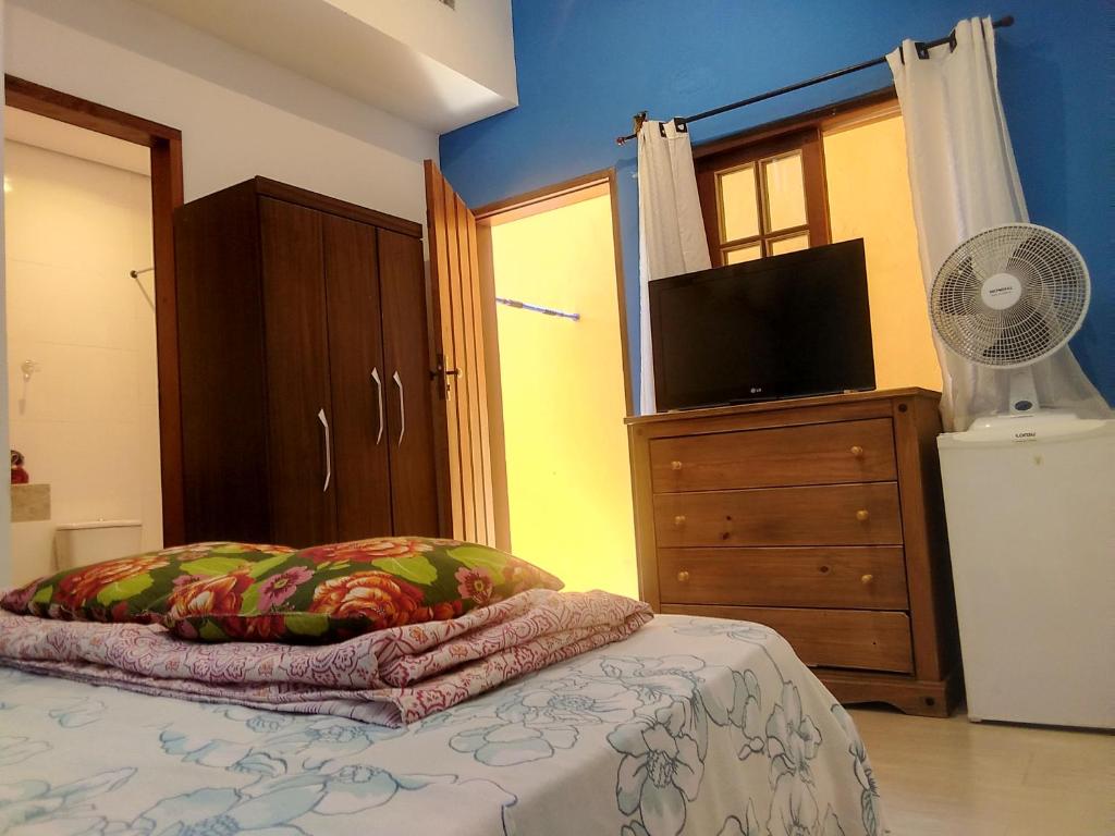 Postel nebo postele na pokoji v ubytování Suíte paraty