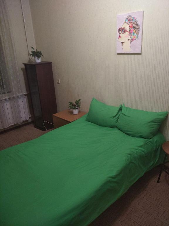 Postel nebo postele na pokoji v ubytování Міні Готель , Кімнати в квартирі - під ключ