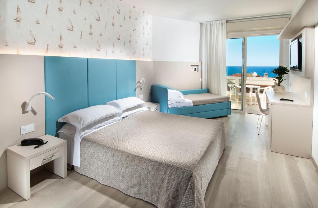 Postel nebo postele na pokoji v ubytování Hotel Prestige