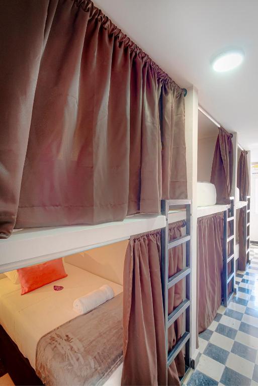 Voodi või voodid majutusasutuse Hotel Dorado Plaza Getsemaní toas