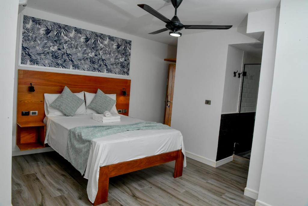 Postel nebo postele na pokoji v ubytování Honky Tonk Punta Cana