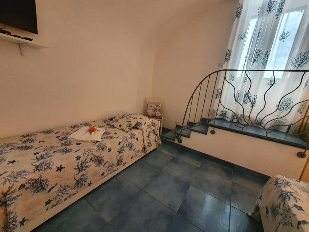 Postel nebo postele na pokoji v ubytování Casa Acqua Marina Ponza