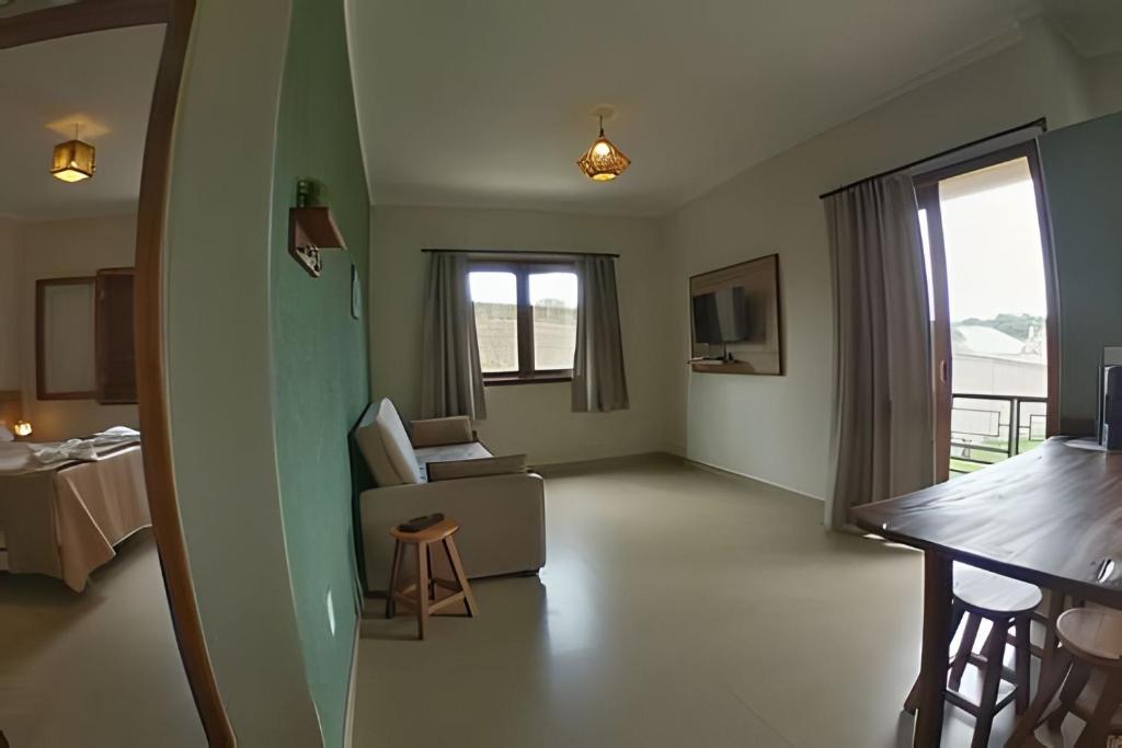 Postelja oz. postelje v sobi nastanitve Canto do Paraiso - Apartamento no Centro com ar condicionado