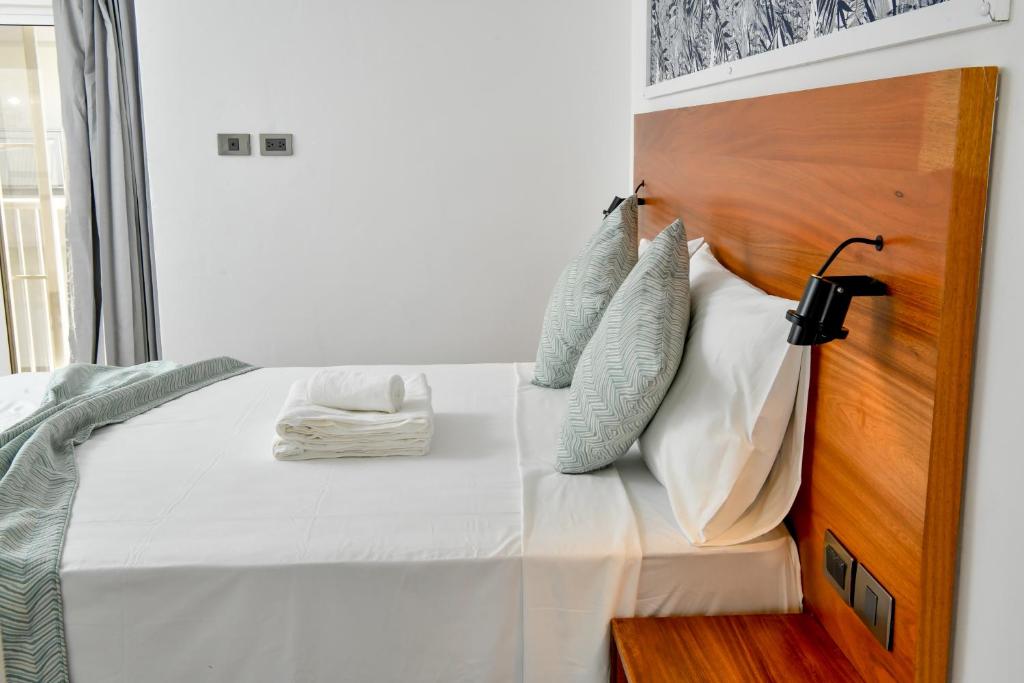 Postel nebo postele na pokoji v ubytování Honky Tonk Punta Cana