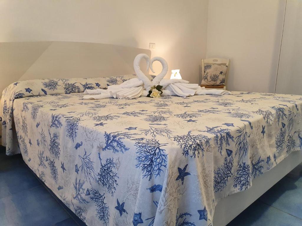 Postel nebo postele na pokoji v ubytování Casa Acqua Marina Ponza
