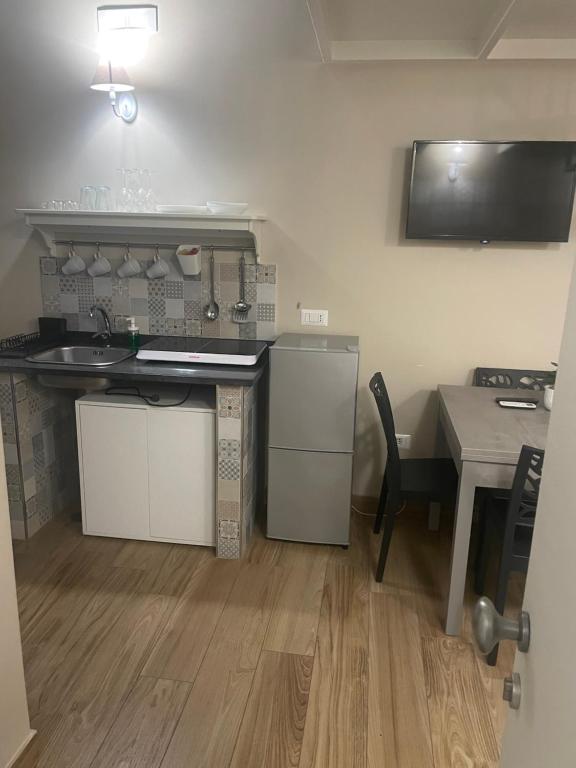 Kuchyň nebo kuchyňský kout v ubytování SOTTOSOPRA APARTMENT