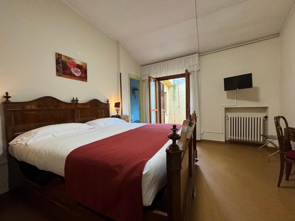Postel nebo postele na pokoji v ubytování Monastero SS. Annunziata