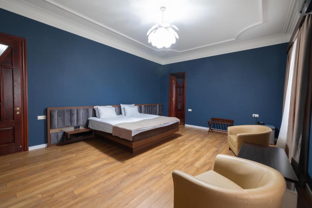 Postel nebo postele na pokoji v ubytování Golden Palace Hotel