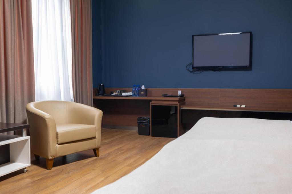TV a/nebo společenská místnost v ubytování Golden Palace Hotel