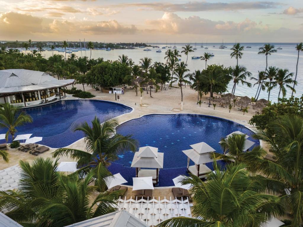 an aerial view of a resort with a large swimming pool at Hilton La Romana All- Inclusive Adult Resort & Spa Punta Cana in Bayahibe
