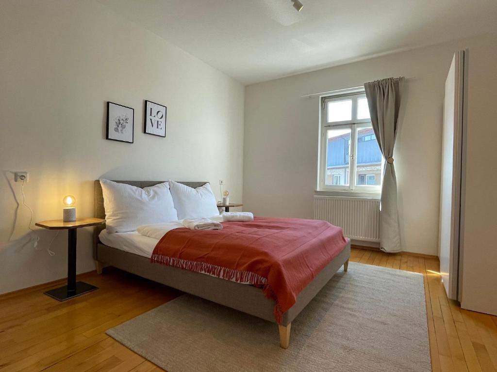 a bedroom with a bed and a window at Studio im Zentrum von Lochau, #4 in Lochau