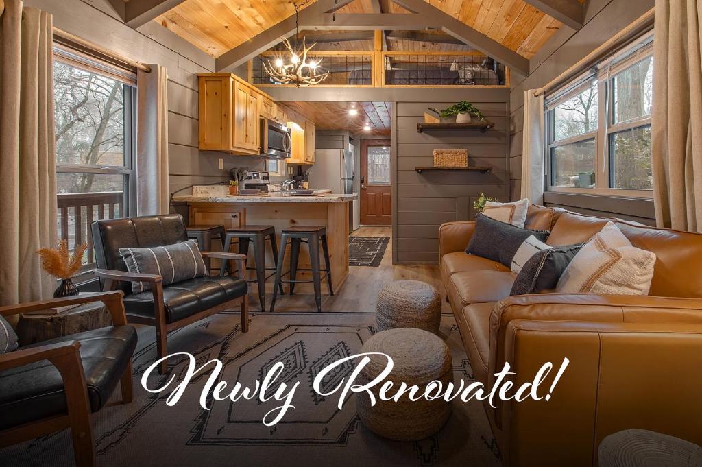 a living room and kitchen in a tiny house at Gabriele Cabin Rustic Retreat Near Downtown in Chattanooga