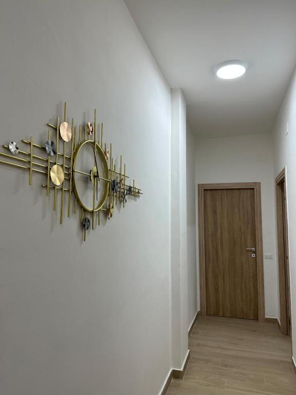 a hallway with a clock on the wall at The Roman Guesthouse in Rome