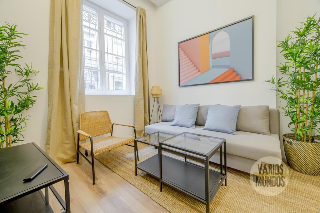 a living room with a couch and a table at Cool And New Apt 3px entre Gran Via y Palacio Real in Madrid