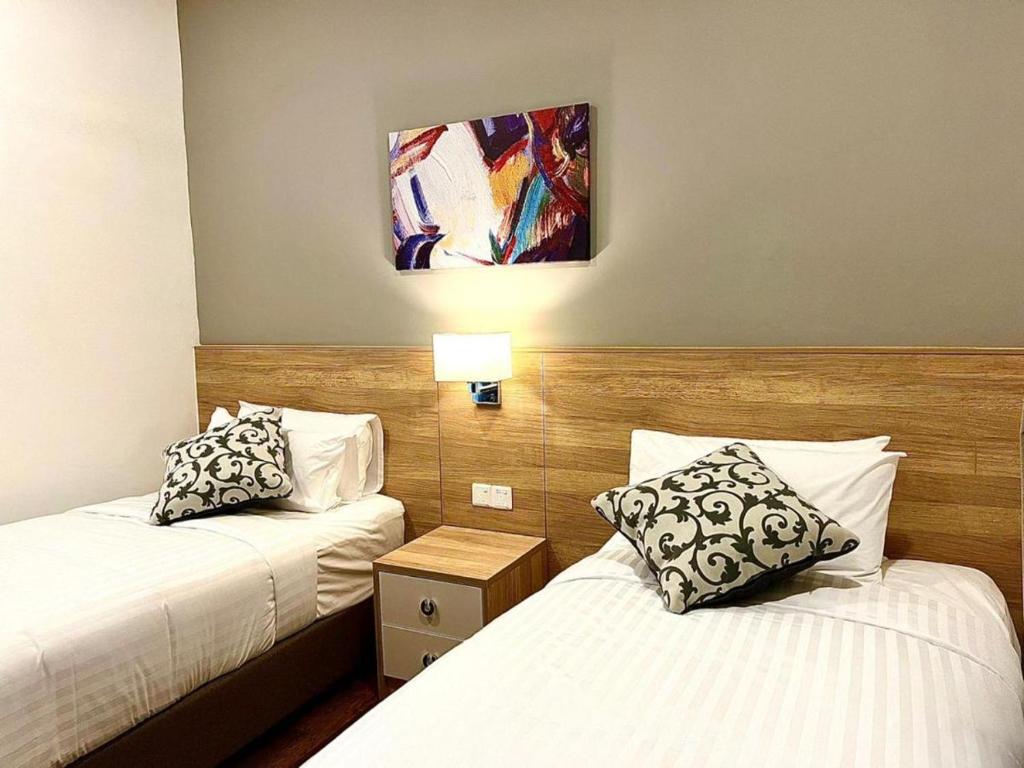 Postel nebo postele na pokoji v ubytování Hotspring 2 Room Suite @ Sunway Onsen with Theme Park View 4 to 6 pax