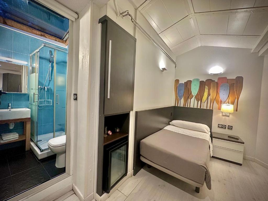 Postel nebo postele na pokoji v ubytování Hotel Punta Monpas