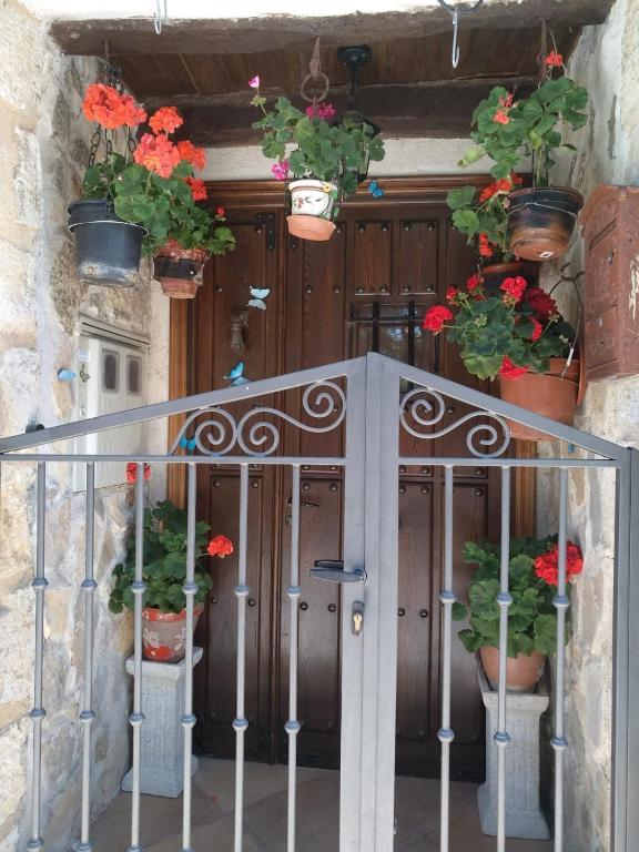 an entrance to a building with potted plants on it at Zohet Santian in Arcones