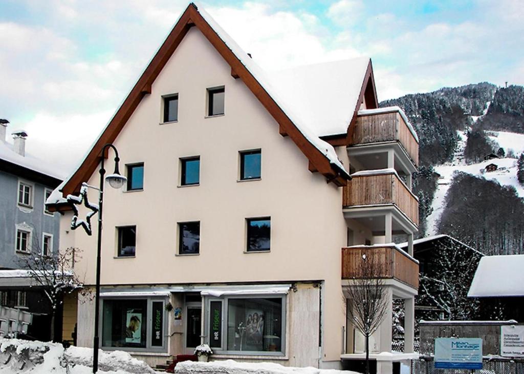 a house with a roof that is covered in snow at Ski-Baki Seka in Schruns