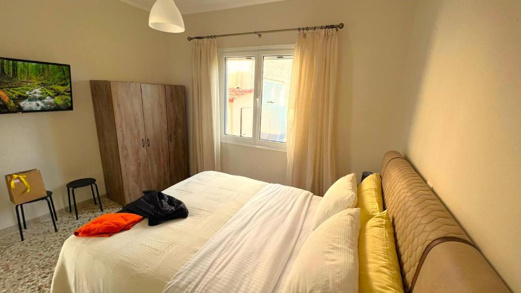 Rúm í herbergi á Itea Home