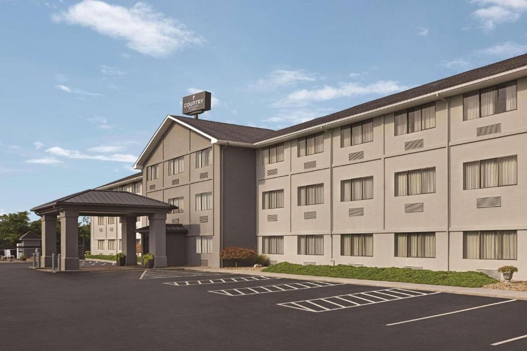 a building with a parking lot in front of it at Country Inn & Suites by Radisson, Abingdon, VA in Abingdon