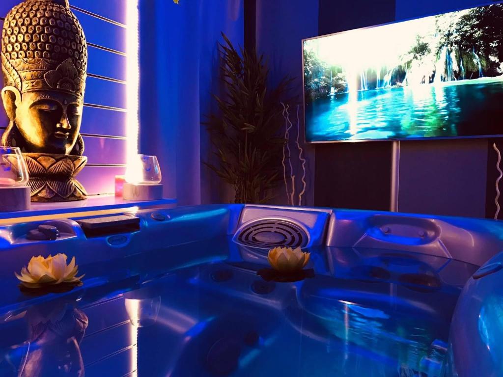 A television and/or entertainment centre at Samsara & Nirvana Suites Apartment