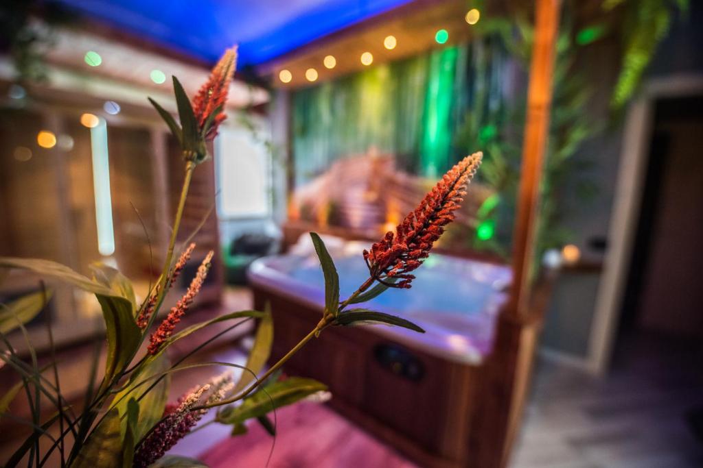 A bed or beds in a room at Samsara & Nirvana Suites Apartment