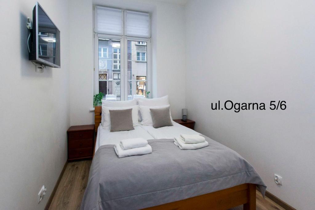 Posteľ alebo postele v izbe v ubytovaní Twój Salon-Apartamenty Stare Miasto