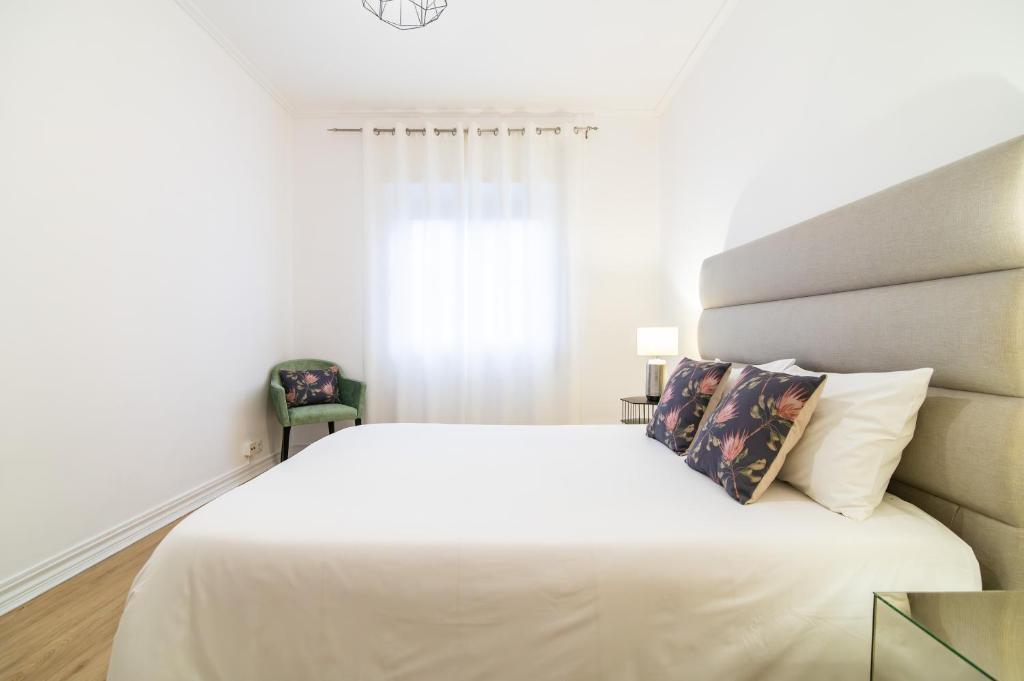 Postel nebo postele na pokoji v ubytování Green Island City Apartment