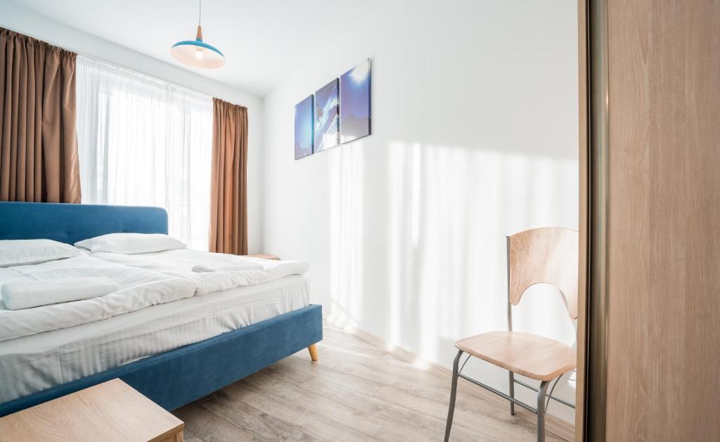 Postel nebo postele na pokoji v ubytování 2-room Apartment NFT New Gudauri 452