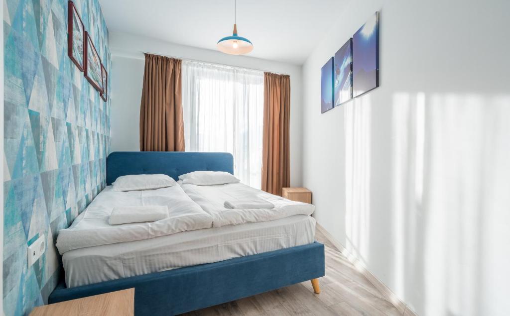 Postel nebo postele na pokoji v ubytování 2-room Apartment NFT New Gudauri 452