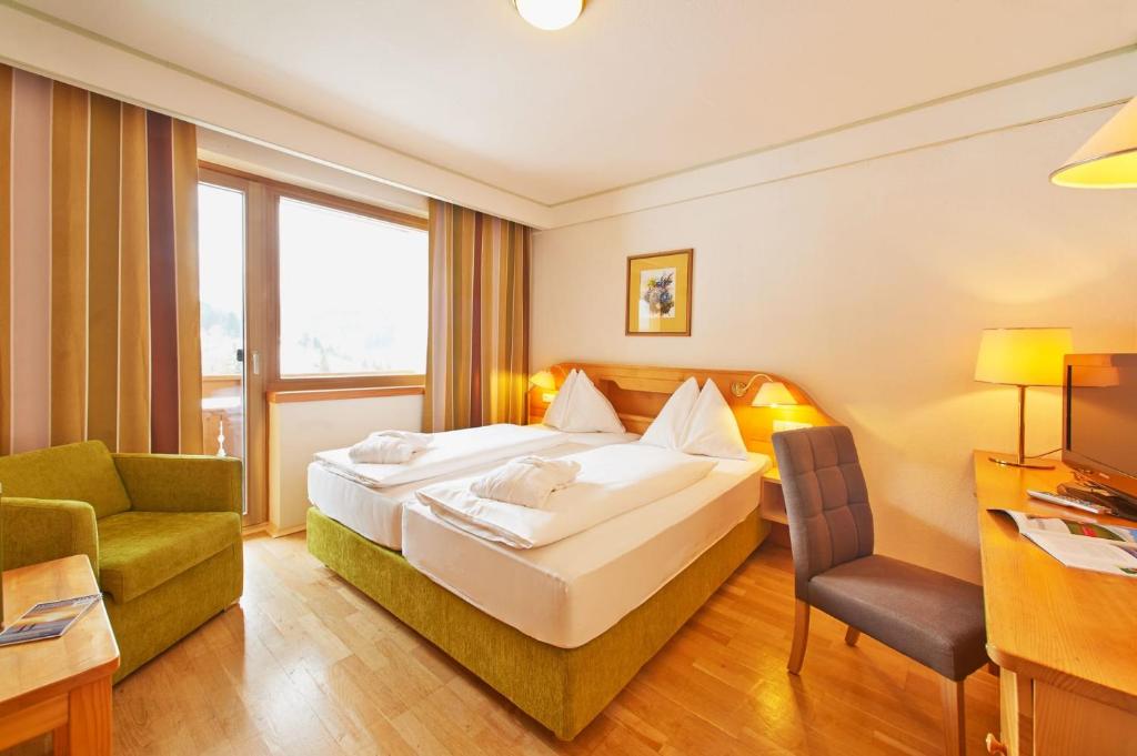 Posteľ alebo postele v izbe v ubytovaní Hotel NockResort