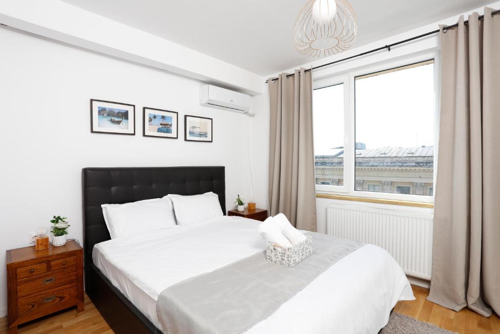 Athenee Calea Victoriei Apartment tesisinde bir odada yatak veya yataklar