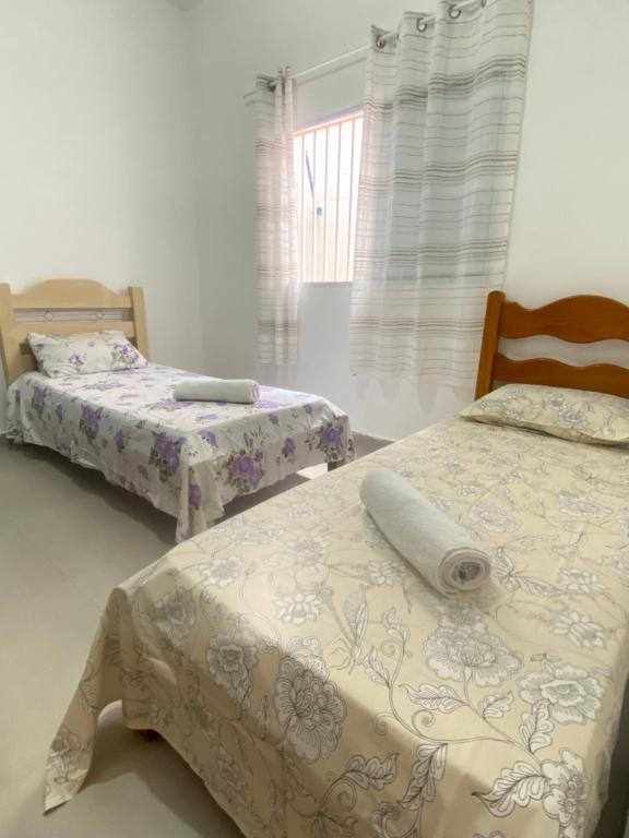 Postel nebo postele na pokoji v ubytování Aconchego! Sua casa com Piscina em Passos!!