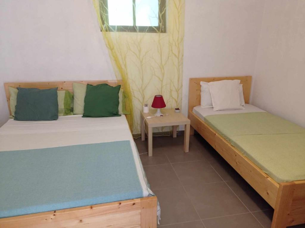 Postel nebo postele na pokoji v ubytování Pousada Cantinho de Preta