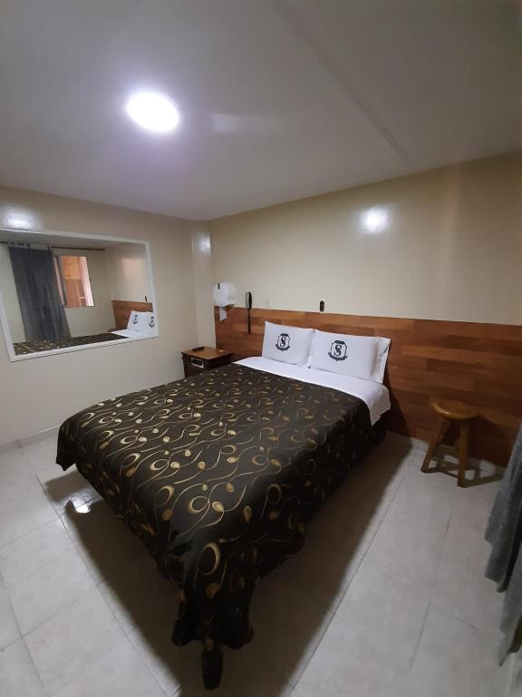Postel nebo postele na pokoji v ubytování Hotel Nuevo Siboney