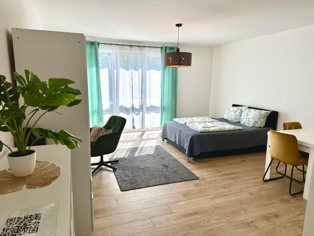 Postel nebo postele na pokoji v ubytování Moderne 1-Zi Stadtwohnung