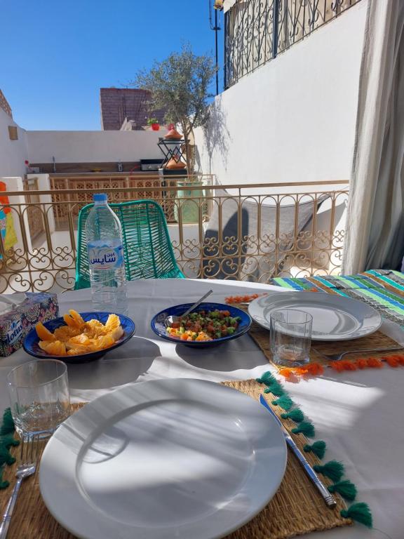 a table with plates and bowls of food on it at Dar Julia in Marrakesh