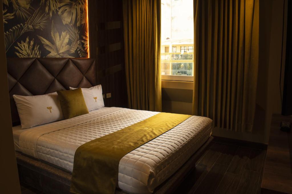 Postel nebo postele na pokoji v ubytování FORTICH APART HOTEL
