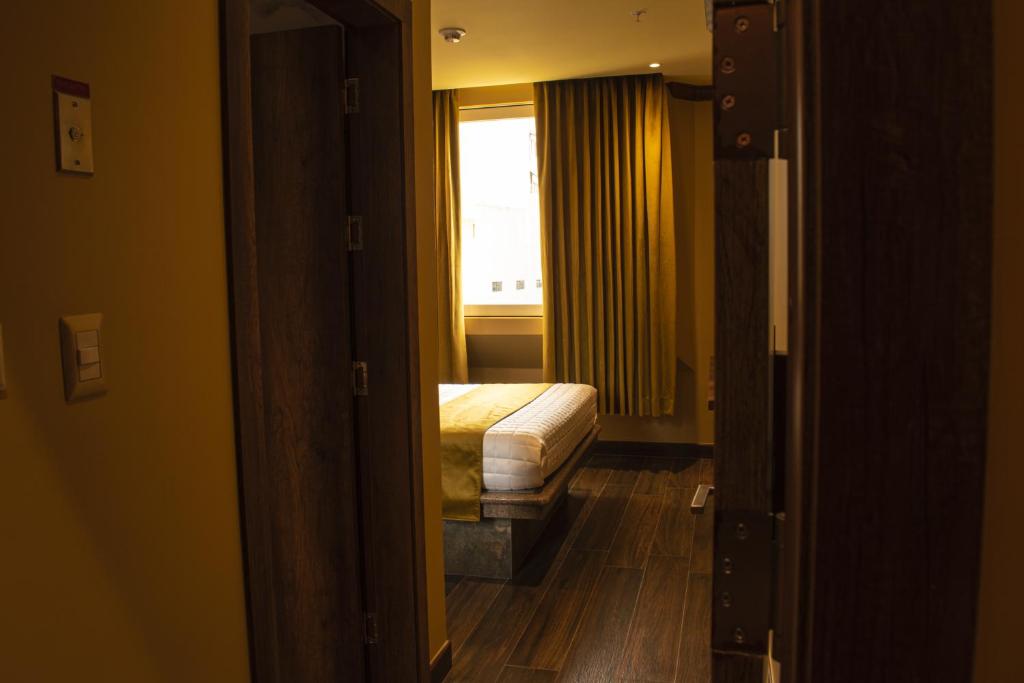 Postel nebo postele na pokoji v ubytování FORTICH APART HOTEL