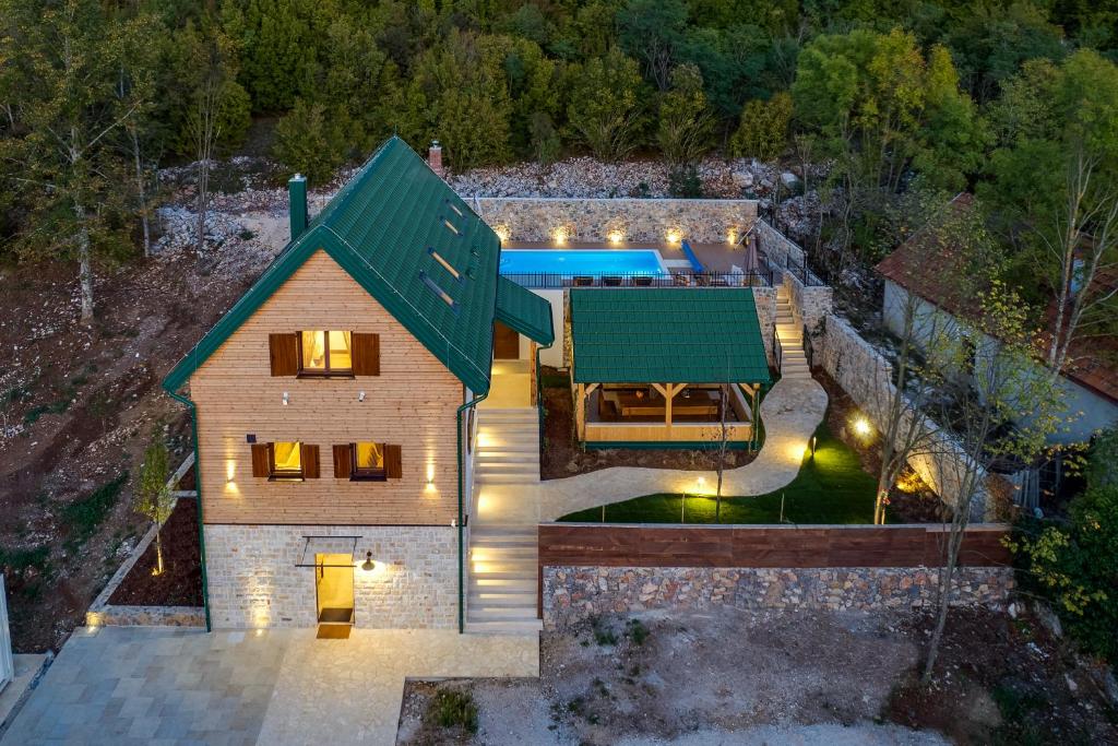 an aerial view of a house with a green roof at SOKOL - Falcon's nest villa in Gračac