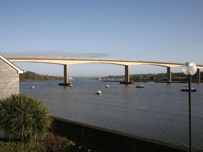 a bridge over a river with boats in the water at 2 Bed in Bideford RIVES in Bideford