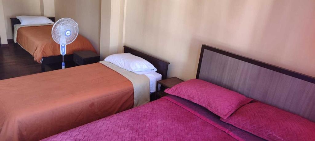 Postel nebo postele na pokoji v ubytování HOTEL DACIN